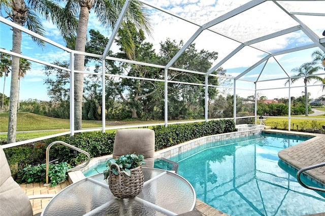 view of swimming pool with glass enclosure