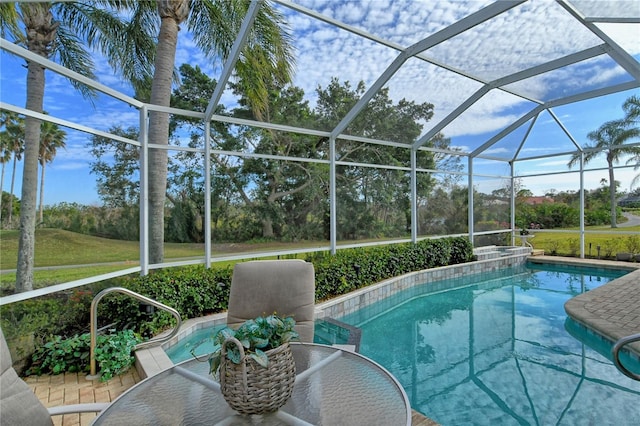 view of pool featuring a lanai