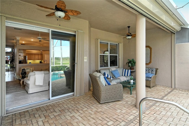 view of patio with an outdoor hangout area and ceiling fan