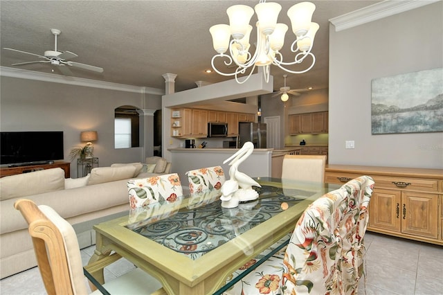 tiled dining room with ceiling fan with notable chandelier, a textured ceiling, and crown molding