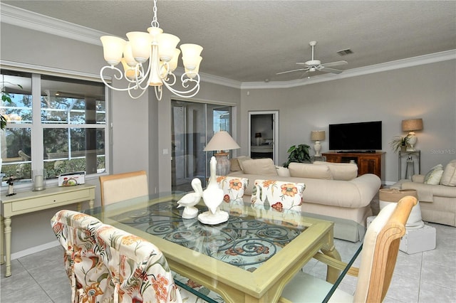 tiled dining area with ceiling fan with notable chandelier, ornamental molding, and a textured ceiling