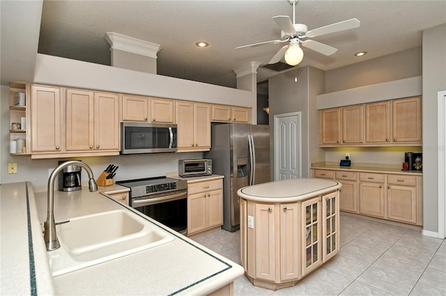 kitchen with ceiling fan, light brown cabinets, stainless steel appliances, a high ceiling, and light tile patterned flooring