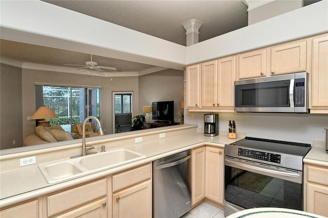 kitchen featuring sink, kitchen peninsula, stainless steel appliances, and light tile patterned floors