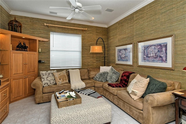 tiled living room with ceiling fan and crown molding