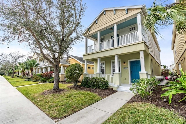 view of front of house with a balcony