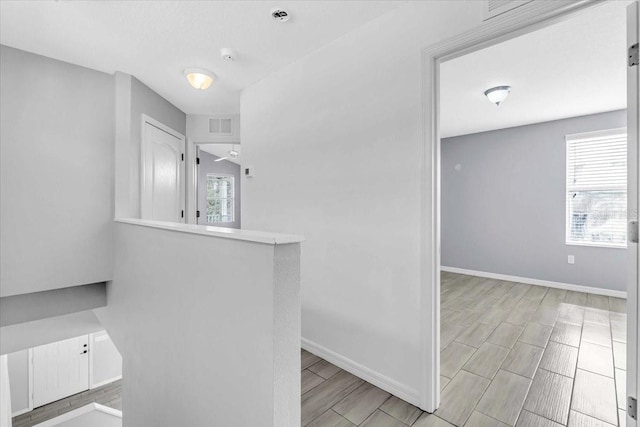 bathroom with a wealth of natural light and ceiling fan