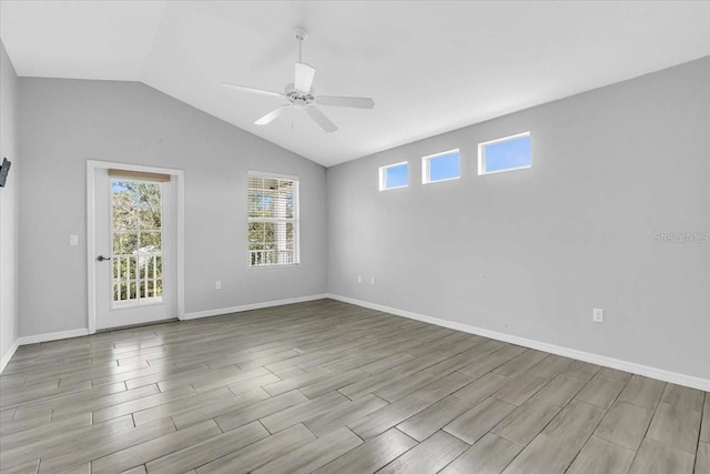 spare room with ceiling fan and vaulted ceiling