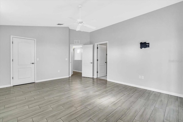 unfurnished room featuring ceiling fan and lofted ceiling