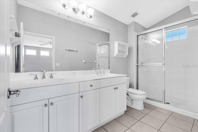 bathroom with tile patterned floors, vaulted ceiling, ceiling fan, walk in shower, and a wealth of natural light