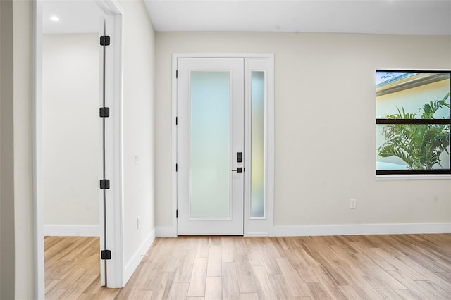 doorway to outside with light wood-type flooring