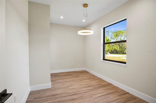 spare room with light hardwood / wood-style flooring