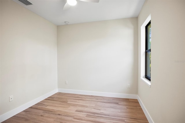 unfurnished room with ceiling fan, a healthy amount of sunlight, and light hardwood / wood-style flooring