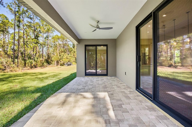 view of patio featuring ceiling fan