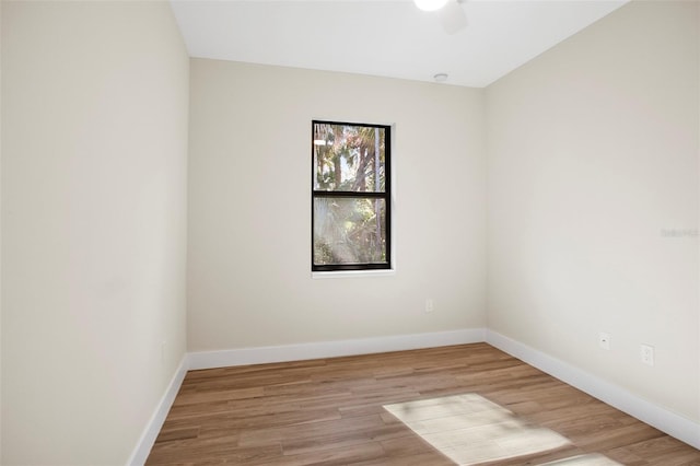 spare room with ceiling fan and light hardwood / wood-style flooring