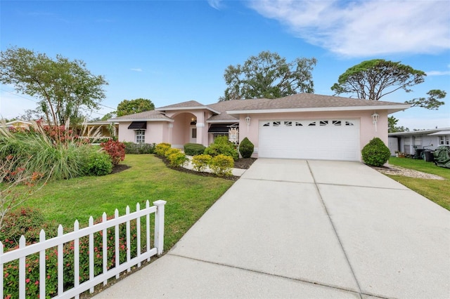 view of front of home with a garage and a front yard