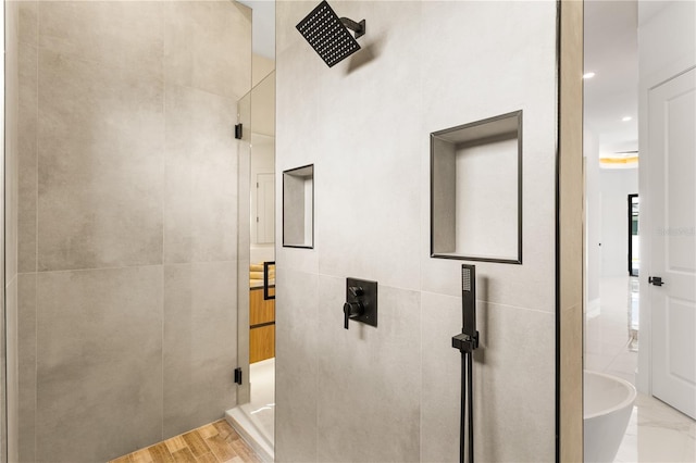 interior space featuring tile walls and light hardwood / wood-style flooring