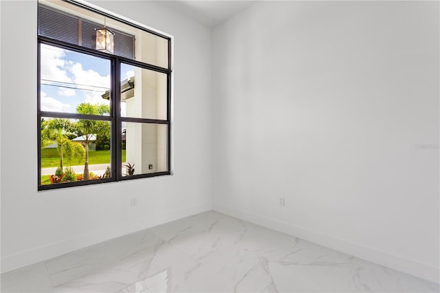 spare room featuring a wealth of natural light