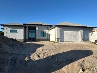 419 NW 4th Ter, Cape Coral, FL 33993 - exterior space with an attached garage