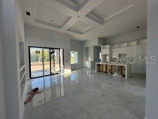 419 NW 4th Ter, Cape Coral, FL 33993 - interior space featuring beam ceiling, a high ceiling, and coffered ceiling
