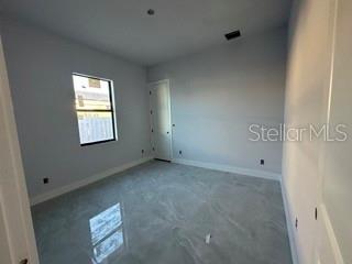 419 NW 4th Ter, Cape Coral, FL 33993 - unfurnished room with visible vents and baseboards