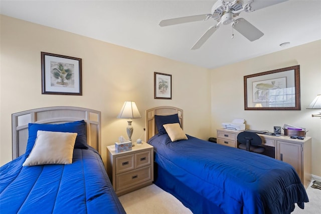 bedroom featuring ceiling fan and light carpet