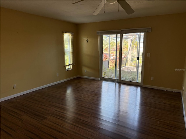 unfurnished room featuring ceiling fan and dark hardwood / wood-style floors