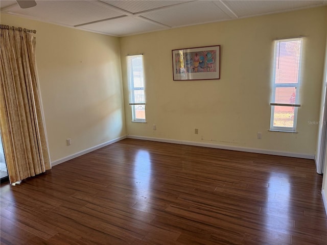 empty room with dark hardwood / wood-style floors