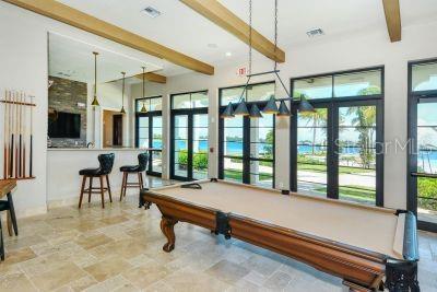 rec room with beamed ceiling, french doors, and pool table