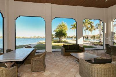 view of patio / terrace with an outdoor hangout area and a water view