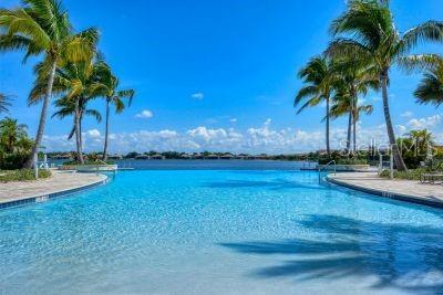 view of swimming pool featuring a water view