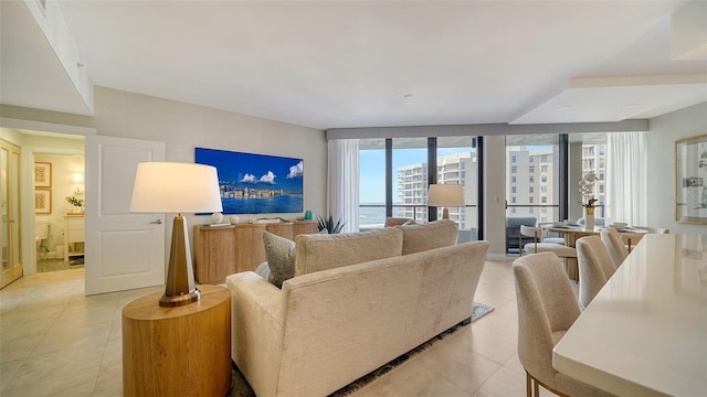 tiled living room with floor to ceiling windows