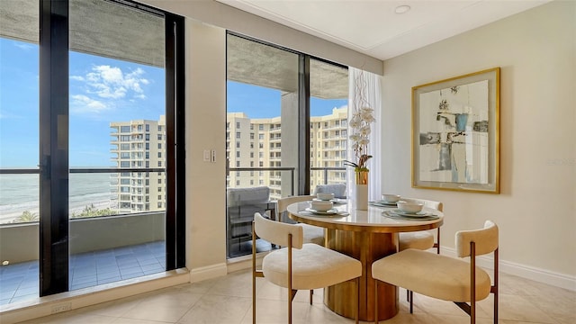 tiled dining space with a water view