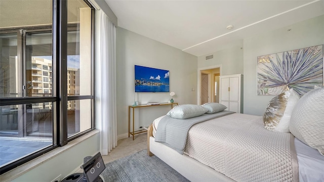 bedroom featuring light tile patterned floors