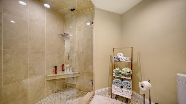 bathroom with tile patterned flooring and an enclosed shower