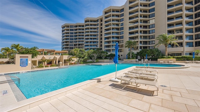 view of swimming pool with a patio