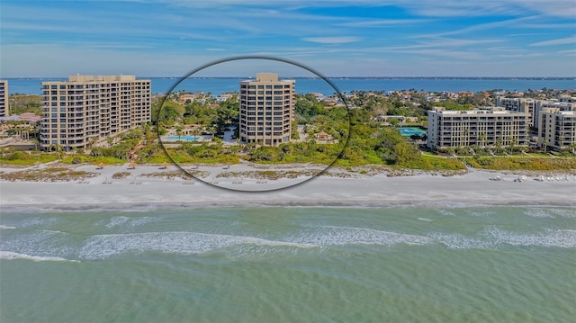 aerial view featuring a water view and a beach view