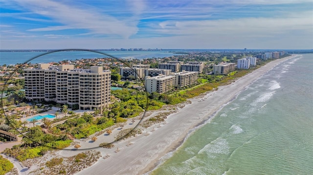 bird's eye view featuring a water view and a view of the beach