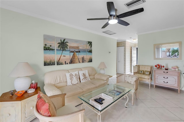 living room featuring light tile patterned floors, ceiling fan, and crown molding