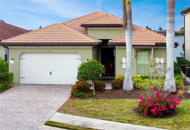 mediterranean / spanish house with a garage