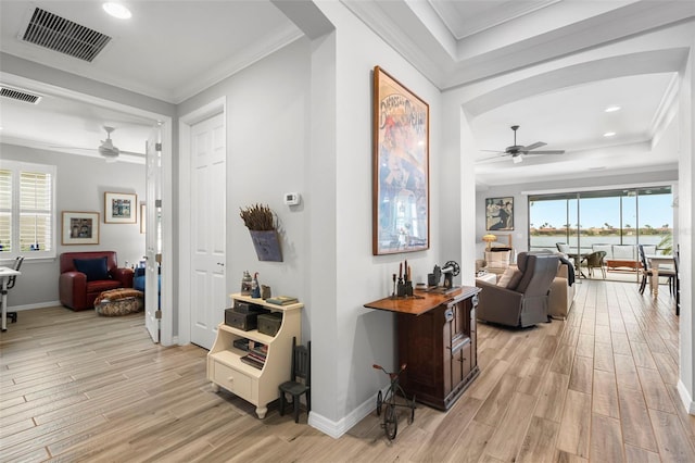 corridor featuring light hardwood / wood-style floors and ornamental molding