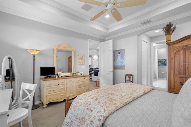 bedroom with carpet floors, a closet, ceiling fan, and ornamental molding