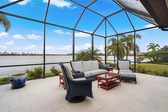 view of patio with glass enclosure, a water view, and an outdoor hangout area