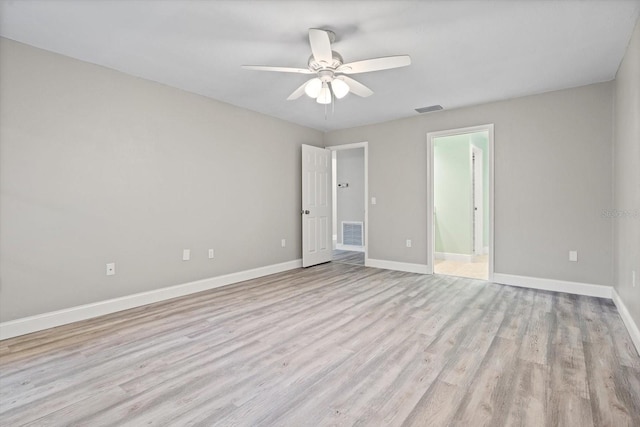 unfurnished bedroom featuring ceiling fan, light wood-type flooring, and ensuite bath