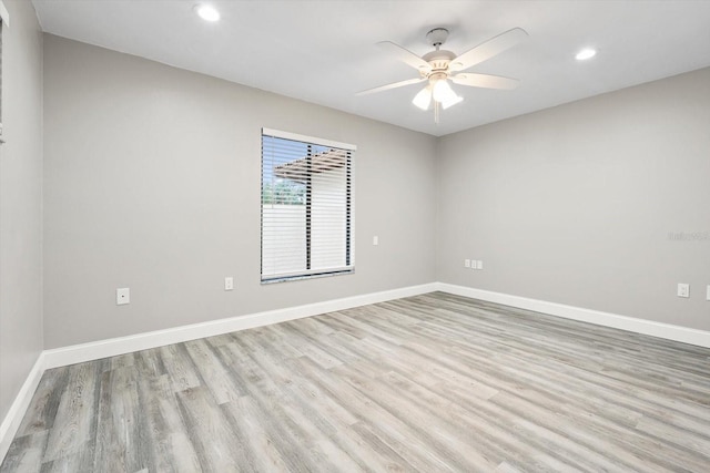 unfurnished room featuring ceiling fan and light hardwood / wood-style flooring