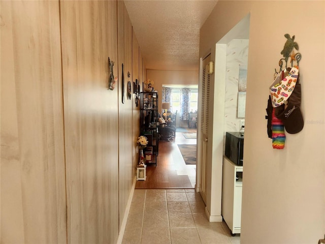 hallway featuring a textured ceiling