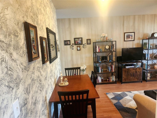 dining space with hardwood / wood-style floors