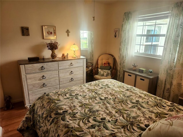 bedroom featuring hardwood / wood-style flooring