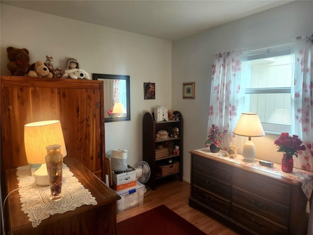 bedroom with hardwood / wood-style floors