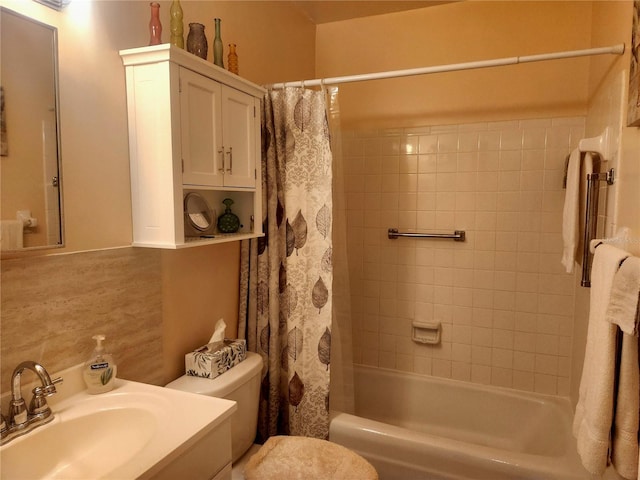 full bathroom with vanity, toilet, and shower / bath combo with shower curtain