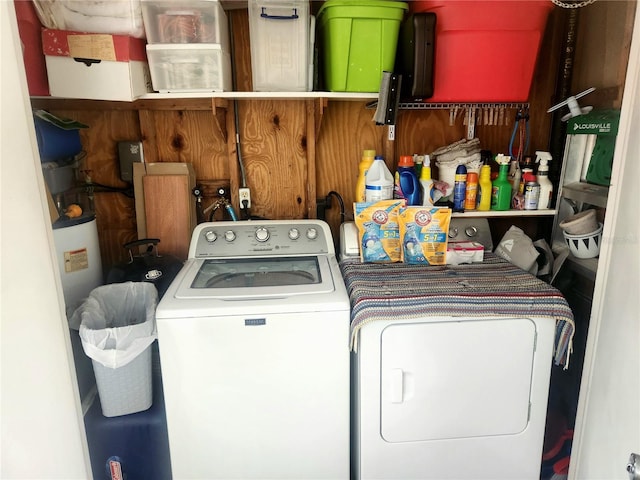 laundry area featuring separate washer and dryer and water heater